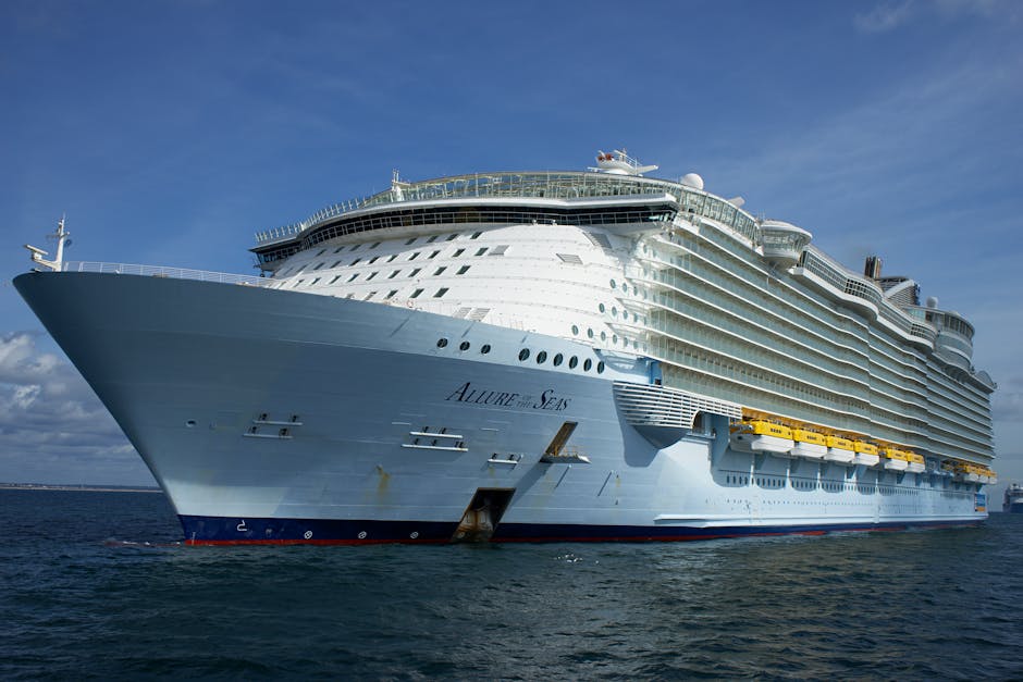 Majestic Allure of the Seas cruise ship sailing on the ocean under clear blue skies.