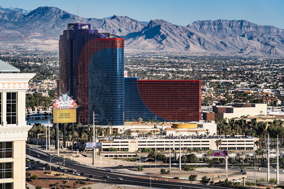 A breathtaking shot of the Rio Hotel and Casino set against the Las Vegas skyline and mountains.