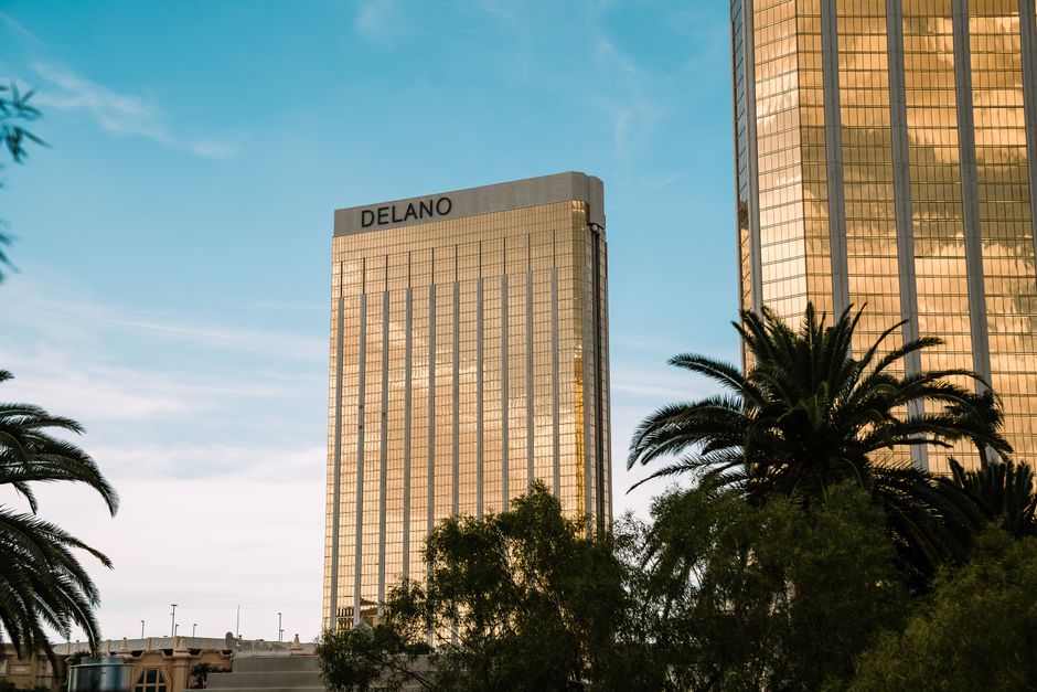Iconic Delano hotel towers in Las Vegas glistening under a clear blue sky.