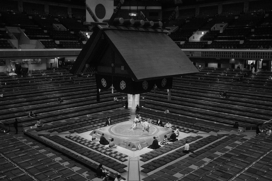 Black and white photo of a sumo wrestling match in Tokyo, Japan.