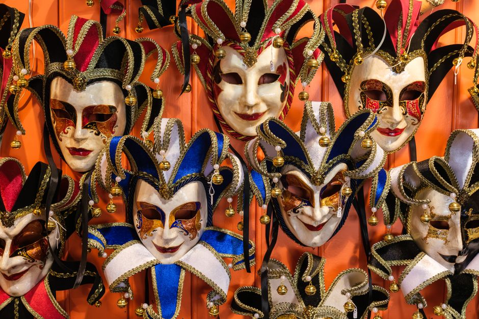 Vibrant Venetian masks showcasing traditional craftsmanship in a festive display.
